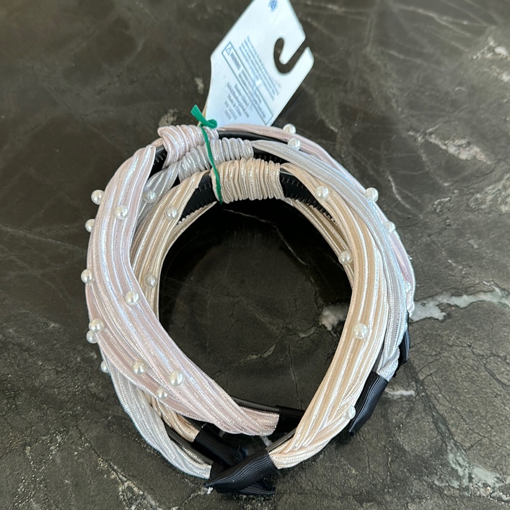 Three head bands new in package